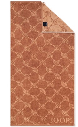 Ręcznik JOOP! Cornflower 1611 38 Kupfer w kolorze miedzianym z eleganckim wzorem chabru, wykonany z miękkiej bawełny o gramaturze 600 g/m²
